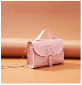 Macro detail of elegant pink crocodile pattern on a chic Korean style chain shoulder bag
