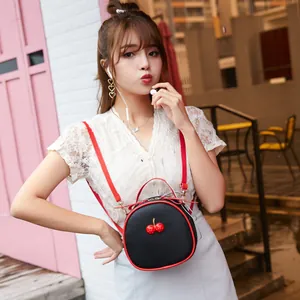 Trendy cherry crossbody bag with black lychee texture and red straps for women
