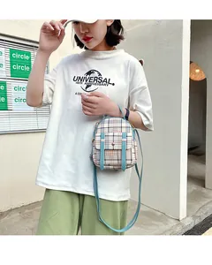 Asian model wearing a stylish plaid mini backpack and crossbody bag with blue straps.