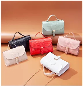Collection of croc embossed pattern small crossbody flap bags in six pastel colors.