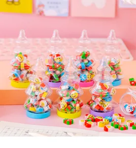 Detail view of cute Christmas tree shaped bottles filled with mini cartoon erasers