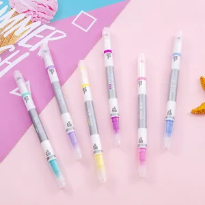 Set mit 6 bunten radierbaren Textmarkern in Pastellfarben auf dekorativem rosa Hintergrund