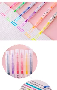 Macro detail of dual-tip highlighters showing chisel and fine points for underlining.