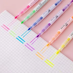 Set of 6 colorful dual-ended highlighters for student note-taking on grid paper.