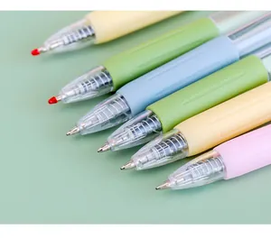Macro view of various colorful pastel retractable gel pens featuring clear bullet tips.