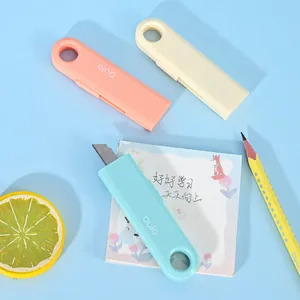 Detail view of mini cloud utility knives with retractable blades for office box cutting