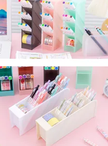 Close-up detail of a minimalist slanted desktop organizer holding pens and washi tapes