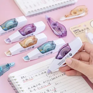 Assorted refillable Morandi color correction tape rollers displayed on a notebook