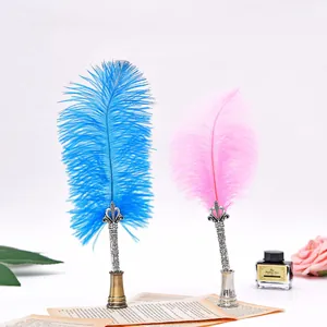 Elegant vintage quill pen gift set with colorful feathers and ornate metal holders