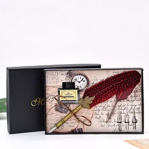 Detailed view of vintage red feather quill pen and ink gift set in a black box