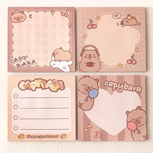 Detailed view of four cute cartoon capybara memo pads for school journaling
