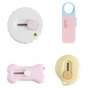 Mini cutter mignon pour ouvrir les colis et couper le papier aux tons pastel