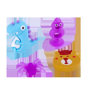 Variety set of cartoon gashapon capsule toy figurines including dinosaur and bear designs