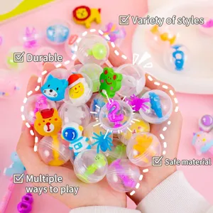Hands holding a collection of 32mm colorful cartoon capsule toy blind boxes for surprise gifts