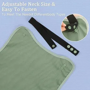 Detailed view of adjustable snap-button neck strap on waterproof adult bib