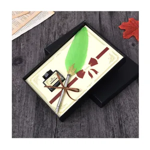 Elegant green feather dip pen and ink gift set in a classic black box for calligraphy