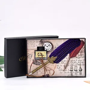 Vintage feather dip pen and ink gift set with replacement nibs in a decorative box