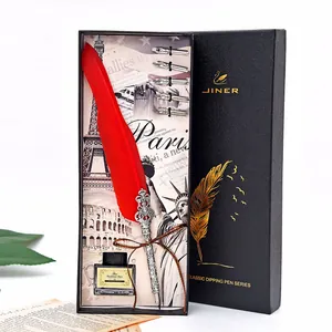 Vintage red quill feather pen gift set with five replacement nibs and black ink bottle in box