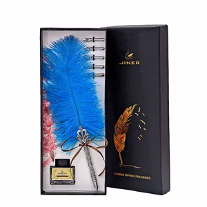 Vintage blue feather quill pen set with ink and 5 replacement nibs in a black gift box