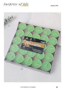 Close-up of green round tea light candles in 50-piece bulk cardboard packaging