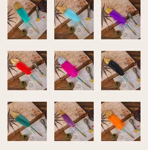 Collection of nine vintage European style gradient feather quill pens in multiple colors