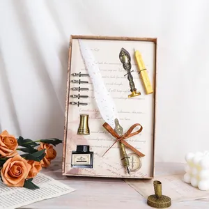 Vintage European quill pen set with ink, nibs, and wax seal in decorative box