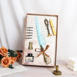 Close-up view of a vintage European quill pen gift set with calligraphy accessories