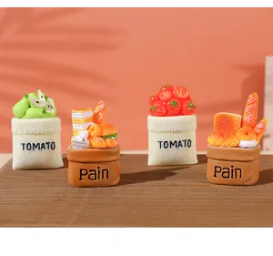 Detailed set of resin miniature food bags with fruit and bread for DIY craft projects.