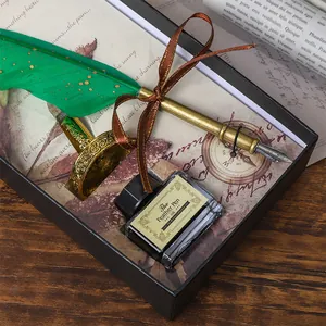 Elegant vintage green feather dip pen gift set including ink and holder in a premium black box.