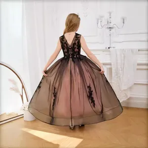 Back view of elegant pink flower girl dress with black lace embroidery and tulle skirt