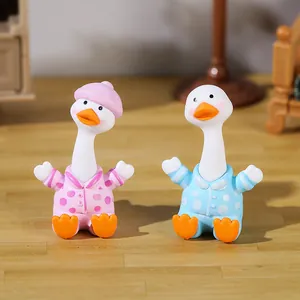 Pair of cute white goose resin figurines in pajamas for home and car desktop decor.
