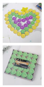 Set of colorful round tea light candles in heart shape and retail packaging detail