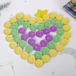 Multicolor round tea light candles arranged in a heart shape for weddings or tea