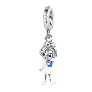 Detail view of silver cartoon nurse charm with red cross and blue clipboard detail.