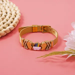 Detailed view of gold mesh bracelet featuring rhinestone charms and Best Friend heart.