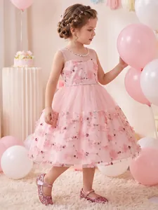 Elegant detail view of a pink embroidered lace flower girl dress with 3D floral appliqués.