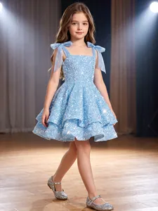 Detailed view of light blue sequined flower girl dress with shoulder bows