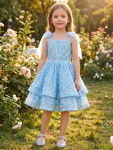 Beautiful sparkling light blue sequined flower girl dress with layered skirt and tulle shoulder ties