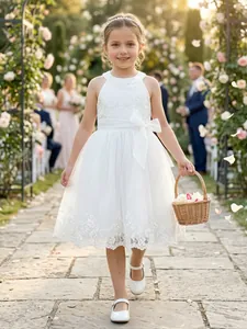 Elegant white lace and mesh flower girl dress with backless design in garden setting