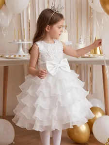 Elegant white floral girl princess dress featuring layered ruffles and a large satin bow