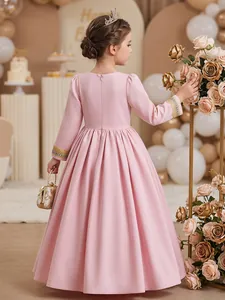 Back view of a girls' pink long-sleeved formal dress with gold lace embroidery details