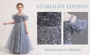 Detail of silver sequined fabric and ruffled mesh sleeves on a girls' princess gown