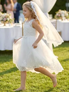 Elegant white lace and tulle flower girl dress with matching floral embroidery veil