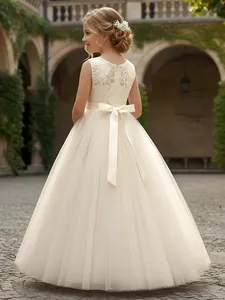 Back view of elegant white tulle flower girl dress with lace bodice and big bow