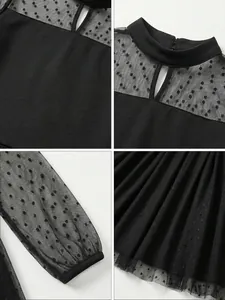 Dettagli della vestaglia in rete nera per bambina con eleganti motivi a pois