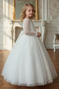 Elegant white lace and mesh flower girl princess dress with long sheer sleeves.