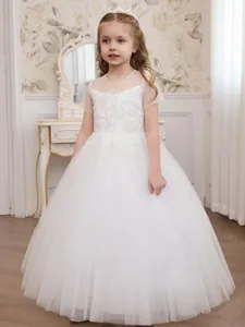 Beautiful white flower girl dress featuring intricate lace embroidery and tulle skirt.