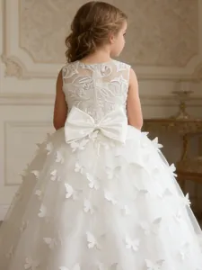 Back view of elegant white lace flower girl dress with large bow and 3D butterflies