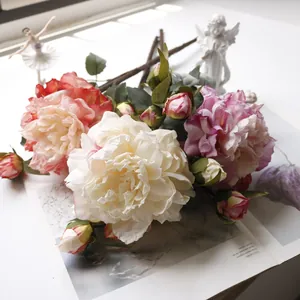 Detailed view of realistic silk peony bouquet in soft pink and white tones