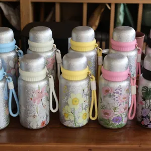 Detailed view of several 3D floral printed stainless steel thermoses with colorful straps.
